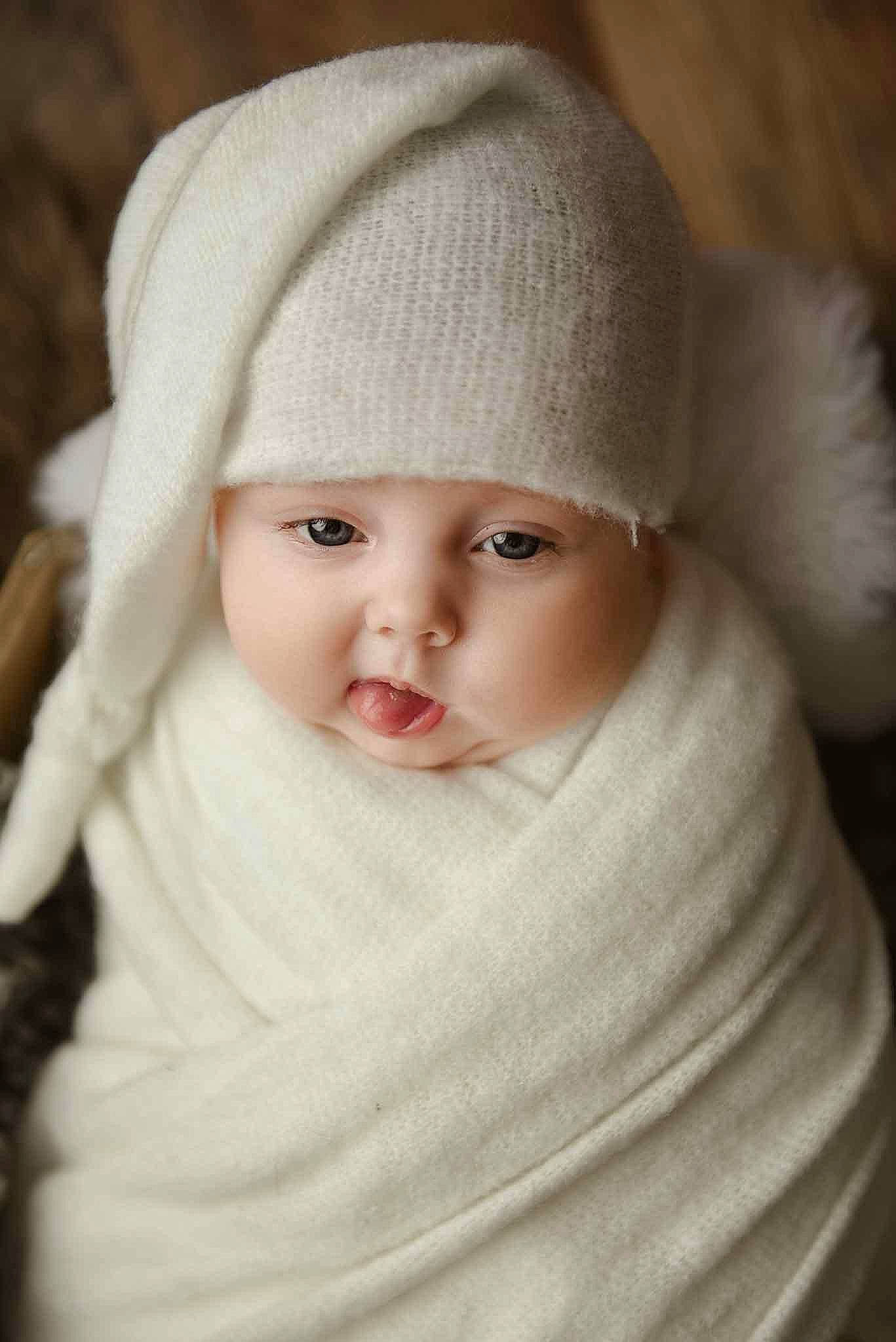 Everly is registered to the contest to win money with this photo: baby, cap, cheek, child, eye, eyebrow, face, fashion_accessory, flash_photography, head, headwear, iris, knit_cap, lip, nose, outerwear, person, skin, sleeve, toddler