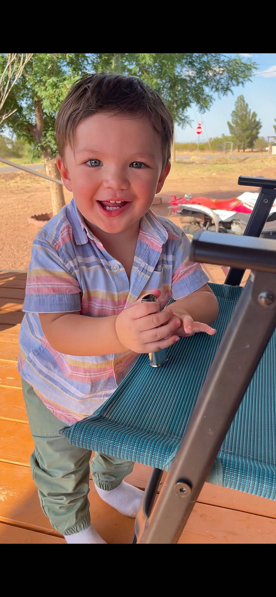 Norsiah joined the competition — help win amazing prizes! chair, child, finger, fun, grass, happy, lap, leisure, outdoor_furniture, person, play, recreation, sitting, skin, smile, thumb, toddler, travel, tree, vacation
