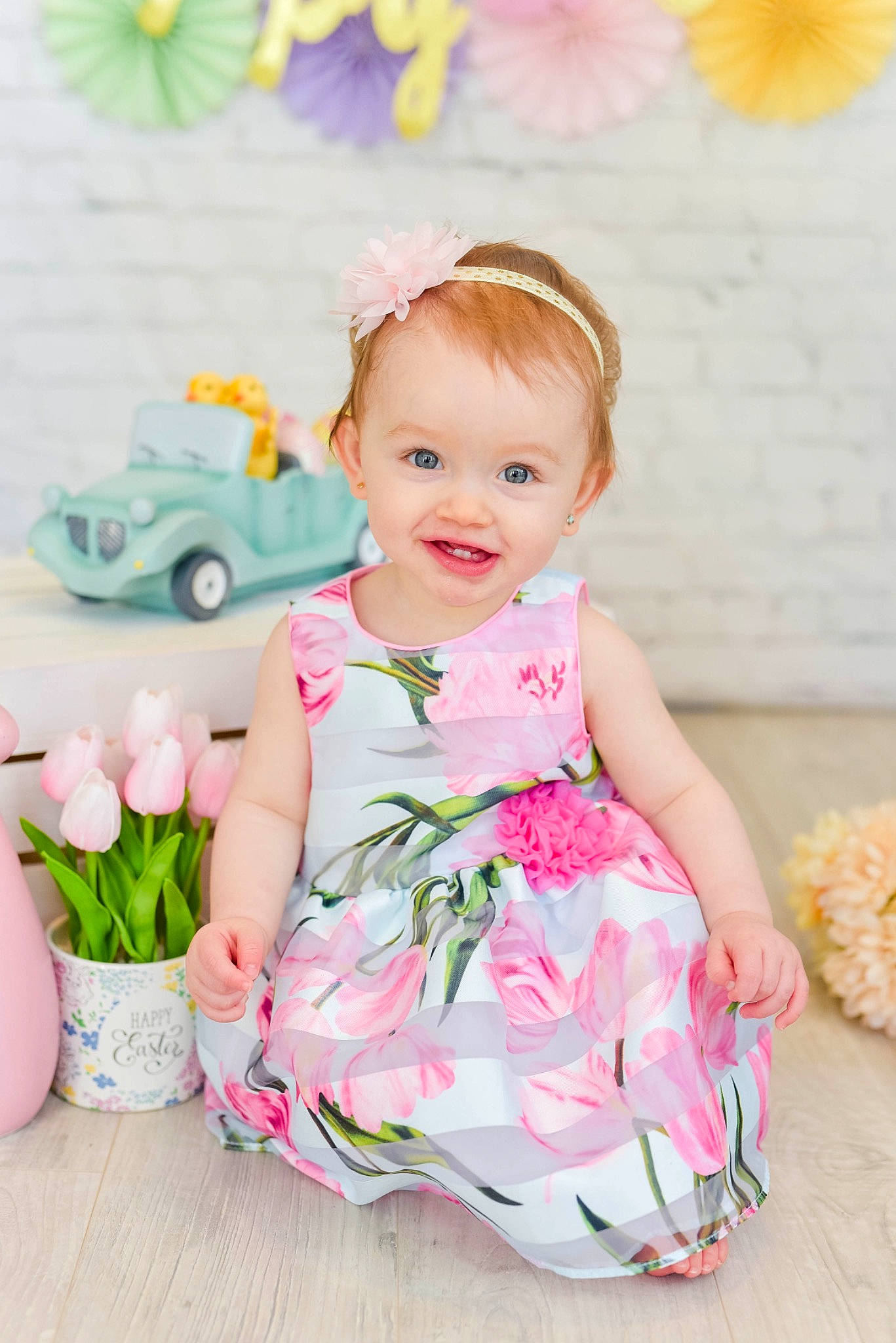 Lakelyn is registered to the contest to win money with this photo: baby, baby_toddler_clothing, child, day_dress, dress, facial_expression, flowerpot, green, happy, joy, magenta, pattern, person, pink, plant, purple, skin, sleeve, smile, toddler