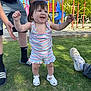 toddler, child, baby, playground, grass, outdoor, summer, romper, sandals, smiling, happy, person, adult, support, play, slide, climbing_frame, sunny, daytime, casual