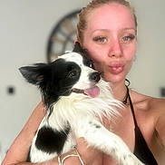 Nacho joined the competition — help win amazing prizes! woman, dog, black_and_white_dog, pet, holding, smiling, face, portrait, indoor, clock, bracelet, blonde_hair, eyelashes, halter_top, tongue_out, cute, happy, closeup, skin, blurred_background