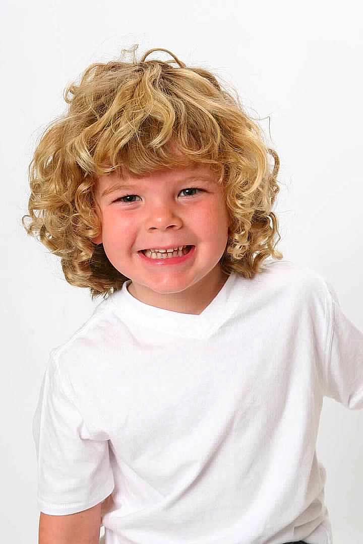 Ashton joined the competition — help win amazing prizes! child, curly_hair, blonde_hair, smiling, white_tshirt, portrait, happy, cute, face, person, studio, innocence, joy, young, kid, headshot, light_background, casual_clothing, childhood, closeup