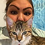 Aria joined the competition — help win amazing prizes! animal, brown, cat, close_up, collar, curious, cute, cute_pet, domestic_animal, eyebrows, face, feline, green_eyes, home, indoor, person, pet, portrait, tabby, white
