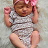 baby, newborn, sleeping, pink_bow, headband, floral_onesie, infant, cute, peaceful, soft_blanket, white_background, tiny_feet, closed_eyes, portrait, child, resting, adorable, skin, newborn_baby, cozy