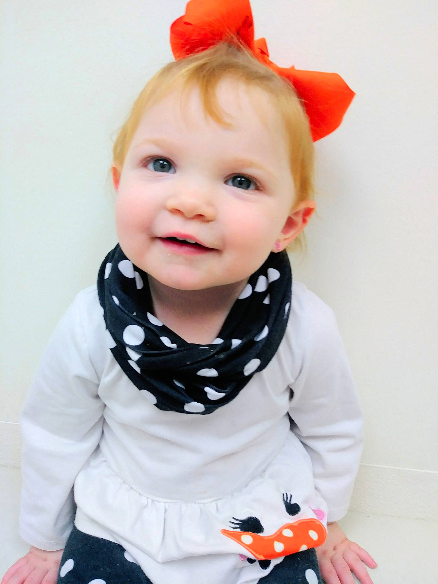 BrayLynn is registered to the contest to win money with this photo: boy, child, child_model, design, hair_accessory, infant, material, neck, orange, outerwear, pattern, person, product, sleeve, smile, textile, toddler