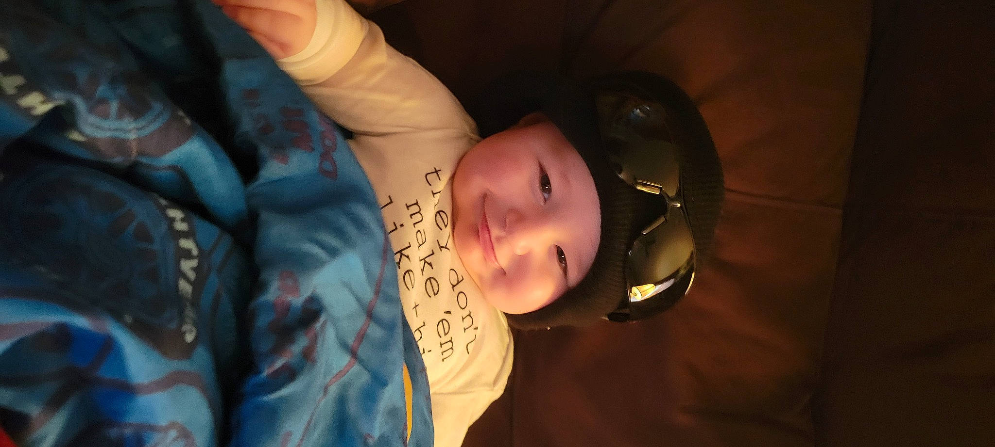 Victor is registered to the contest to win money with this photo: baby, cheek, child, darkness, eyebrow, eyelash, finger, flash_photography, fun, gesture, happy, headwear, helmet, human_body, joy, lip, mouth, nose, person, personal_protective_equipment