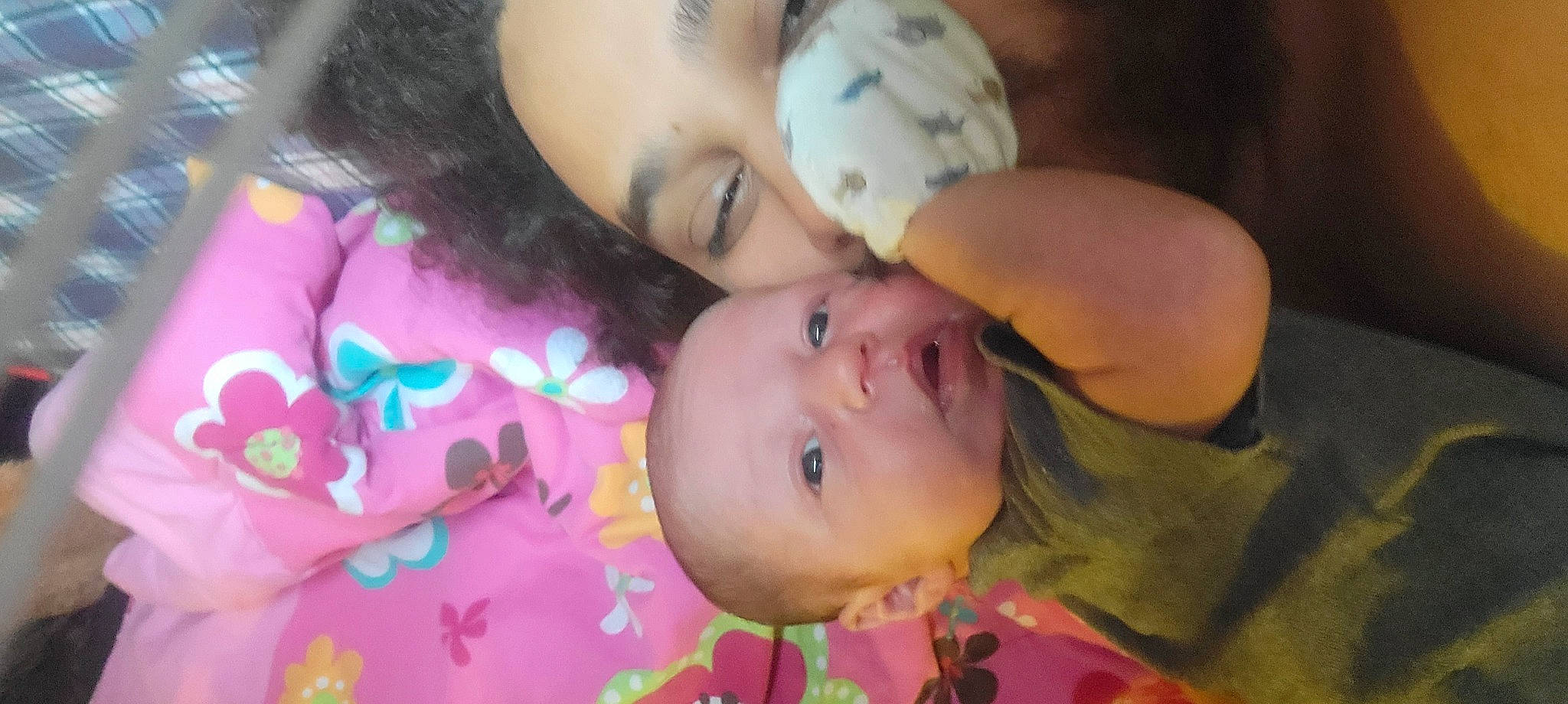 Victor is registered to the contest to win money with this photo: baby, black_hair, cheek, chin, eye, eyebrow, eyelash, face, forehead, happy, iris, lip, mouth, nose, person, pink, plant, skin, textile, toddler