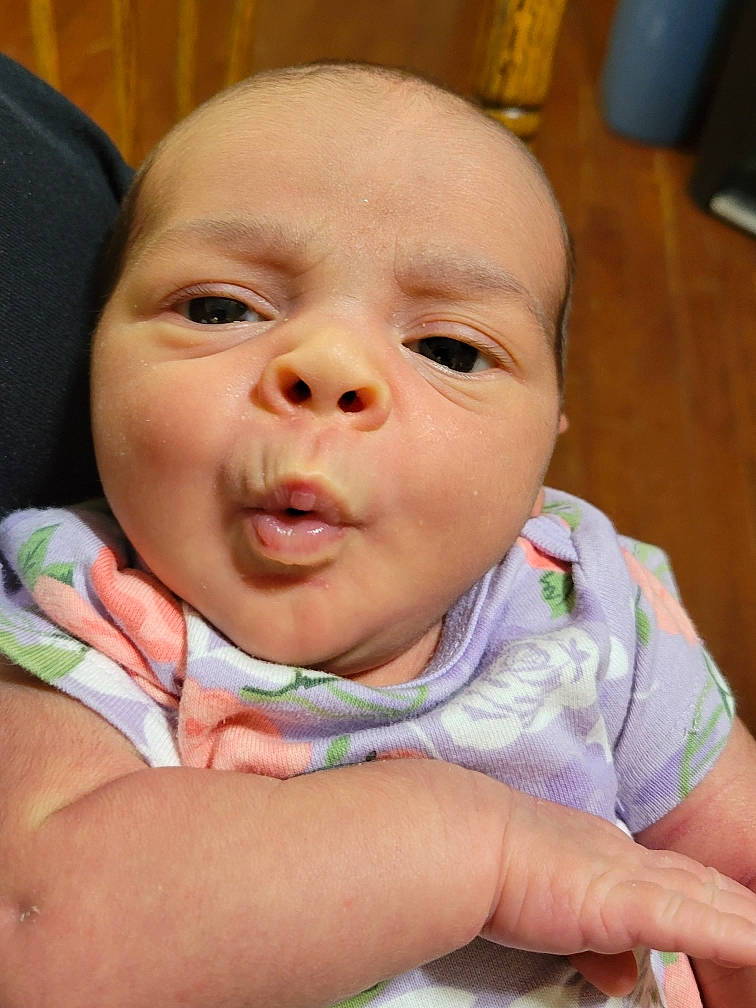 Alora is registered to the contest to win money with this photo: baby, baby_toddler_clothing, cheek, chin, comfort, ear, eye, eyebrow, eyelash, finger, gesture, happy, iris, lip, mouth, nose, person, skin, smile, thumb