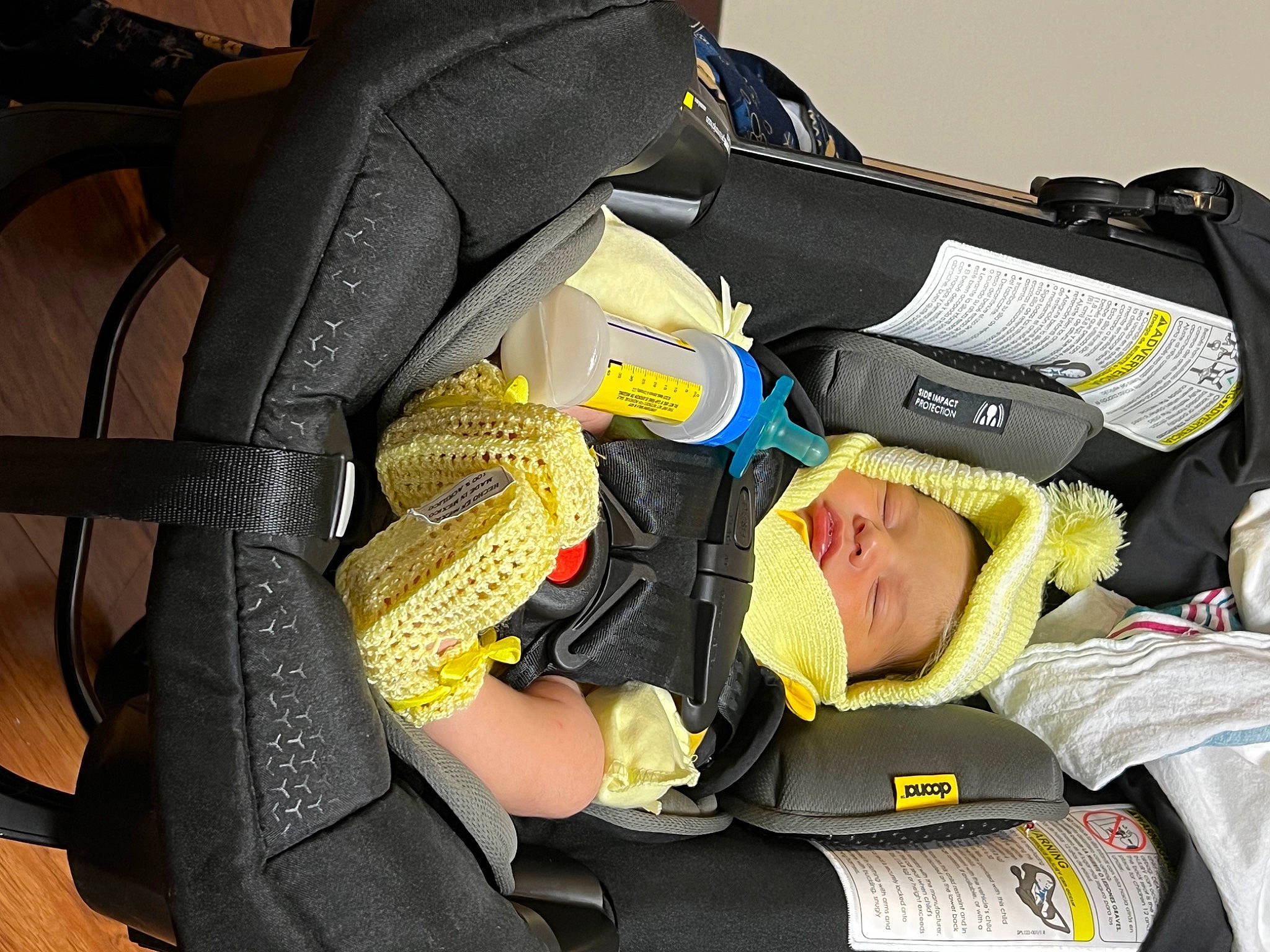 Lucian is registered to the contest to win money with this photo: auto_part, baby, baby_carriage, baby_products, baby_safety, bag, baggage, car_seat, comfort, lap, luggage_and_bags, passenger, person, toddler, travel, yellow
