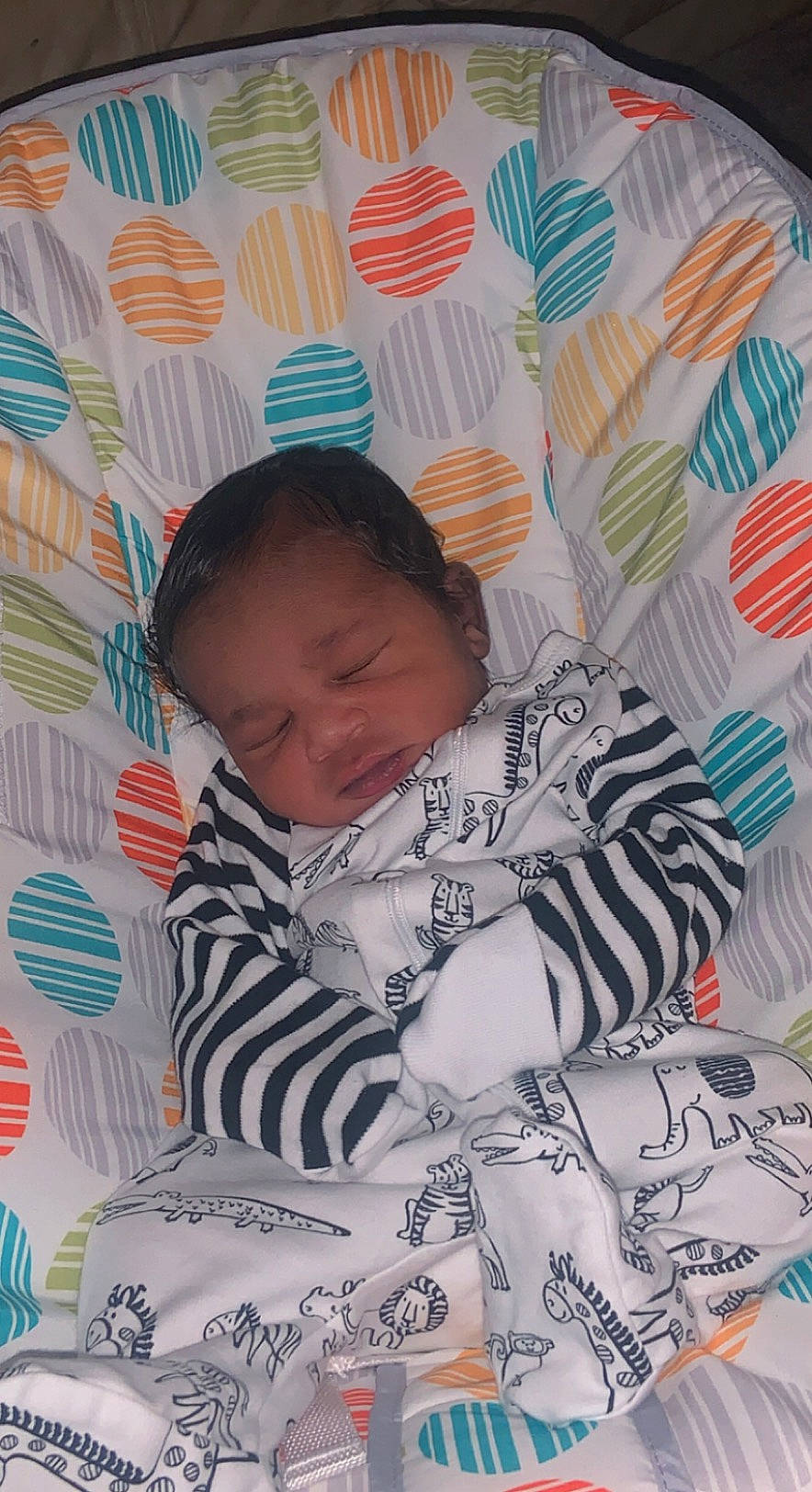 Geovanni is registered to the contest to win money with this photo: baby, baby_products, baby_toddler_clothing, bedding, bedtime, child, comfort, hairstyle, happy, illustration, linens, pattern, person, pink, room, sitting, sleeve, t_shirt, textile, toddler