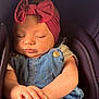 Myla participe au concours pour gagner de l'argent avec cette photo : baby, sleeping, headband, bow, denim, overalls, hands, clasped, cushion, seat, soft_lighting, peaceful, infant, cute, portrait, closeup, child, clothing, indoors, face
