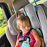 Oaklan is registered to the contest to win money with this photo: toddler, child, car_seat, sleeping, baby_bottle, pigtails, pink_shirt, seatbelt, car_interior, window, daylight, hair_tie, cute, young_child, safety_harness, vehicle, seat, resting, casual, travel