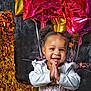 toddler, child, smiling, happy, birthday, balloons, number_one, celebration, party, gold, pink, clothing, face, hands, hair, indoor, portrait, cute, festive, joyful