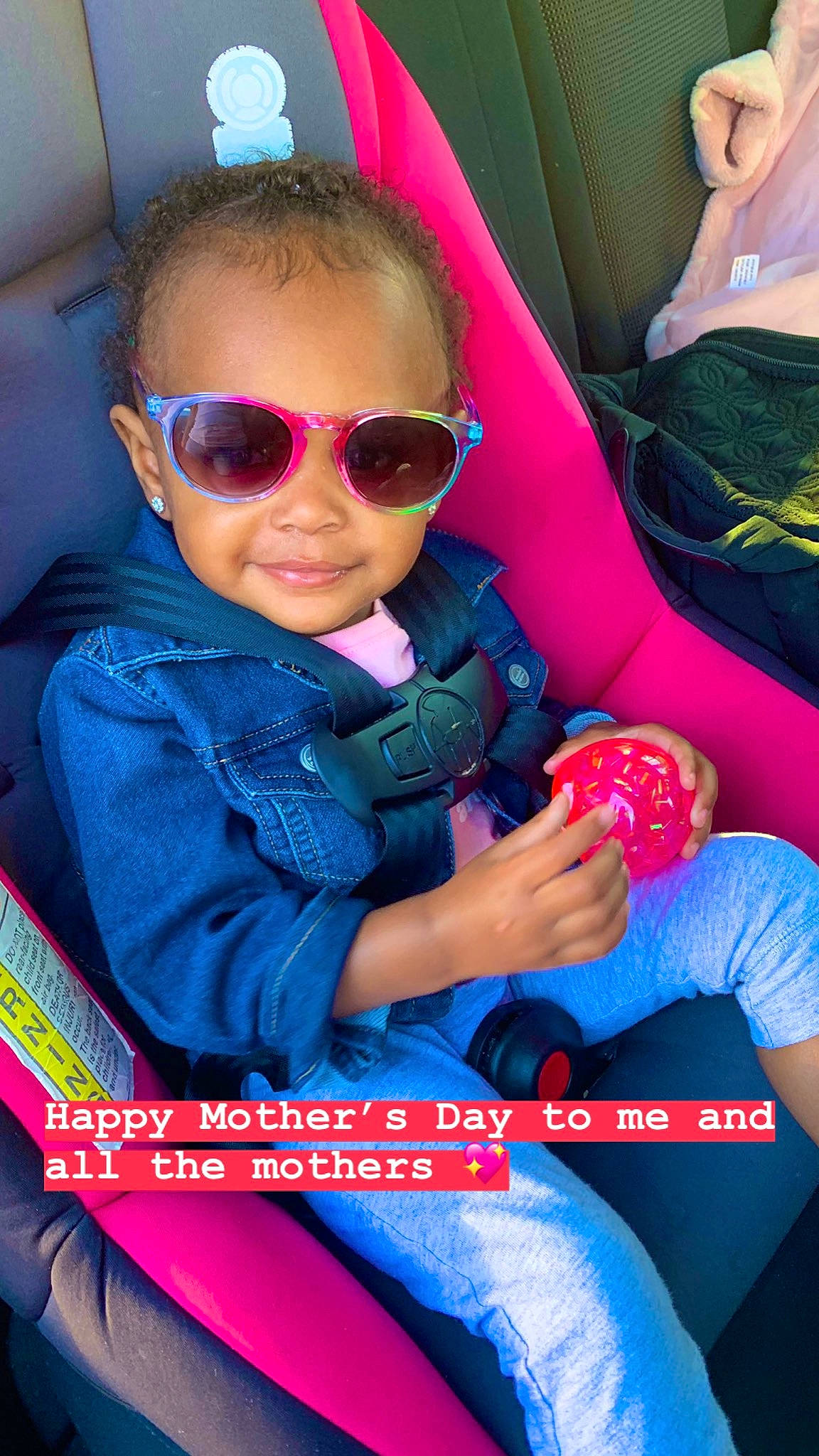 Leiana joined the competition — help win amazing prizes! car_seat, child, cool, eyewear, finger, fun, glasses, joy, magenta, person, personal_protective_equipment, photography, pink, play, sitting, sunglasses, toddler, vision_care