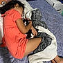 child, sleeping, kitten, cat, bed, blanket, cozy, indoors, resting, cute, animal, pet, comfort, fur, face, cuddle, pink_clothing, hair, floor, relaxation