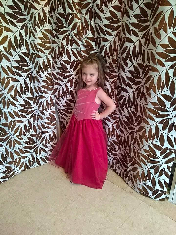 Rosie participe au concours pour gagner de l'argent avec cette photo : a_line, bridal_party_dress, child, day_dress, dress, electric_blue, event, fashion_design, flooring, formal_wear, happy, joy, magenta, one_piece_garment, pattern, person, pink, shoulder, sleeve, textile