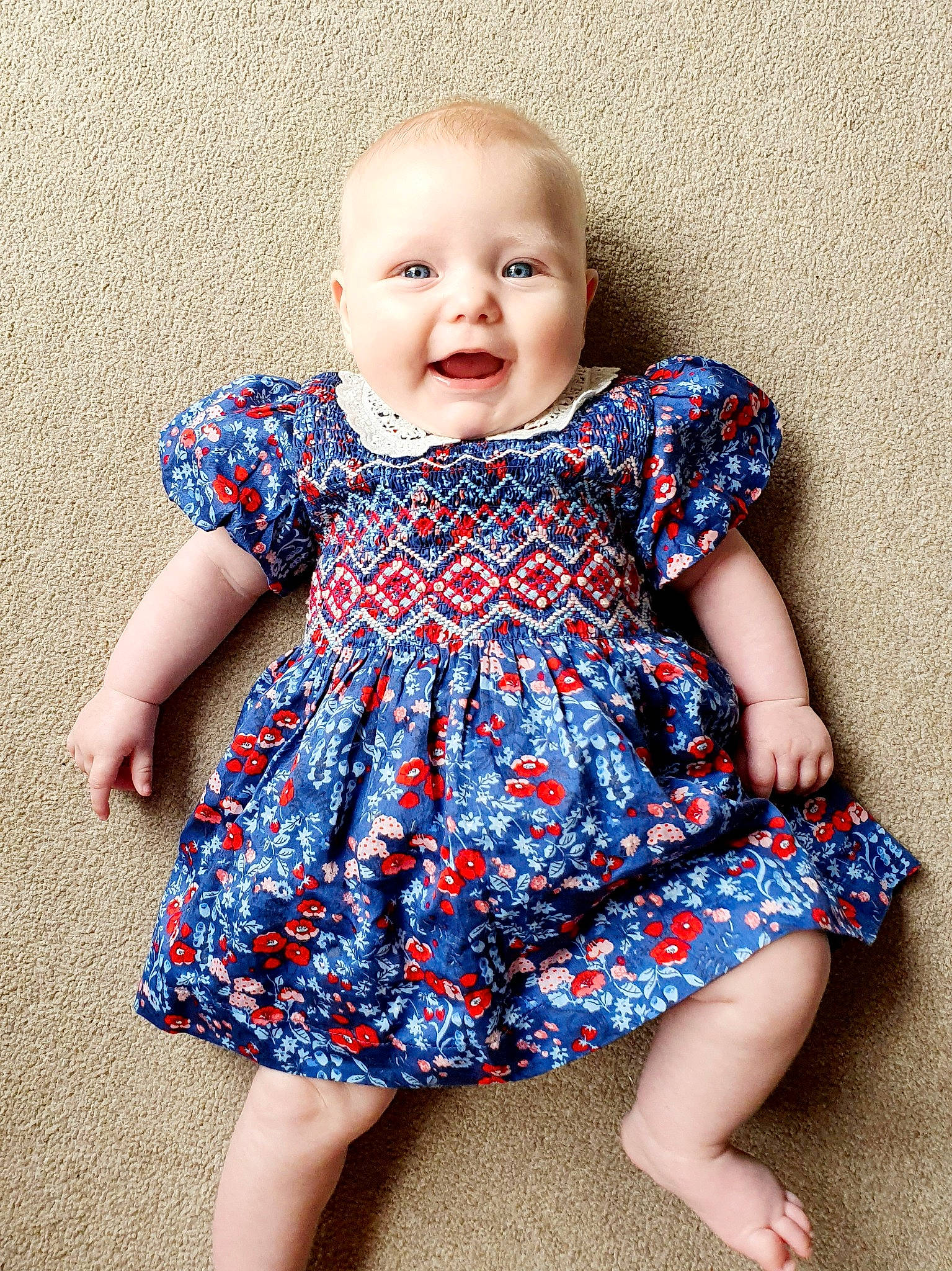 Erin is registered to the contest to win money with this photo: arm, azure, baby_toddler_clothing, child, clothing, collar, day_dress, electric_blue, face, fun, happy, human_leg, neck, one_piece_garment, pattern, person, purple, sleeve, smile, standing
