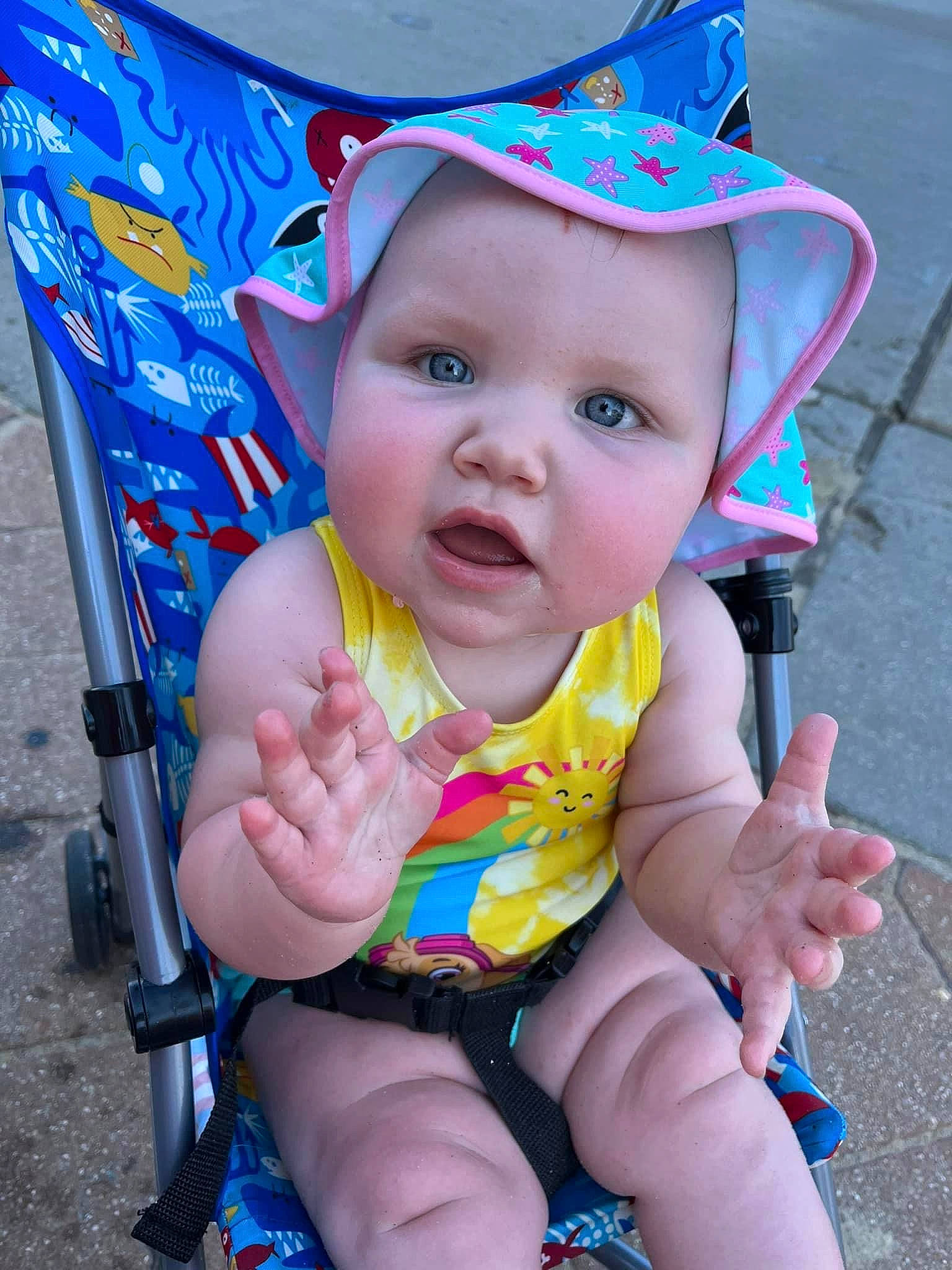 Dahlia is registered to the contest to win money with this photo: baby, baby_carriage, baby_products, baby_toddler_clothing, beauty, blue, cheek, child, electric_blue, eye, fun, happy, hat, headwear, leisure, person, photograph, pink, recreation, skin