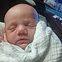 Taylon is registered to the contest to win money with this photo: newborn, baby, sleeping, blanket, indoors, face, infant, wrapped, cozy, peaceful, soft, closeup, portrait, child, resting, cute, human, small, warm, tender