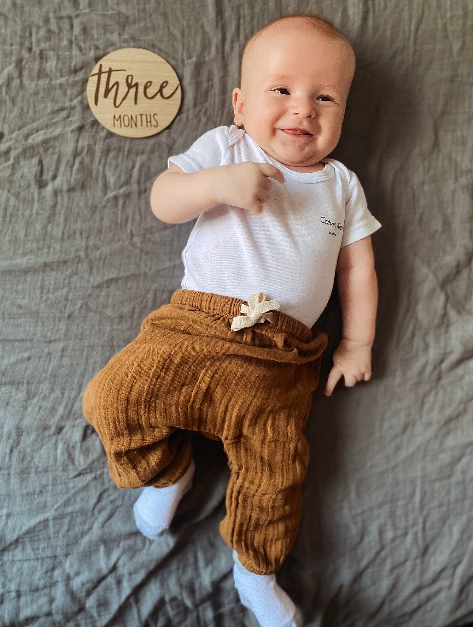 Benji joined the competition — help win amazing prizes! arm, baby, baby_toddler_clothing, cheek, child, collar, flash_photography, happy, human_leg, joy, knee, linens, pattern, person, sitting, skin, sleeve, smile, t_shirt, thigh