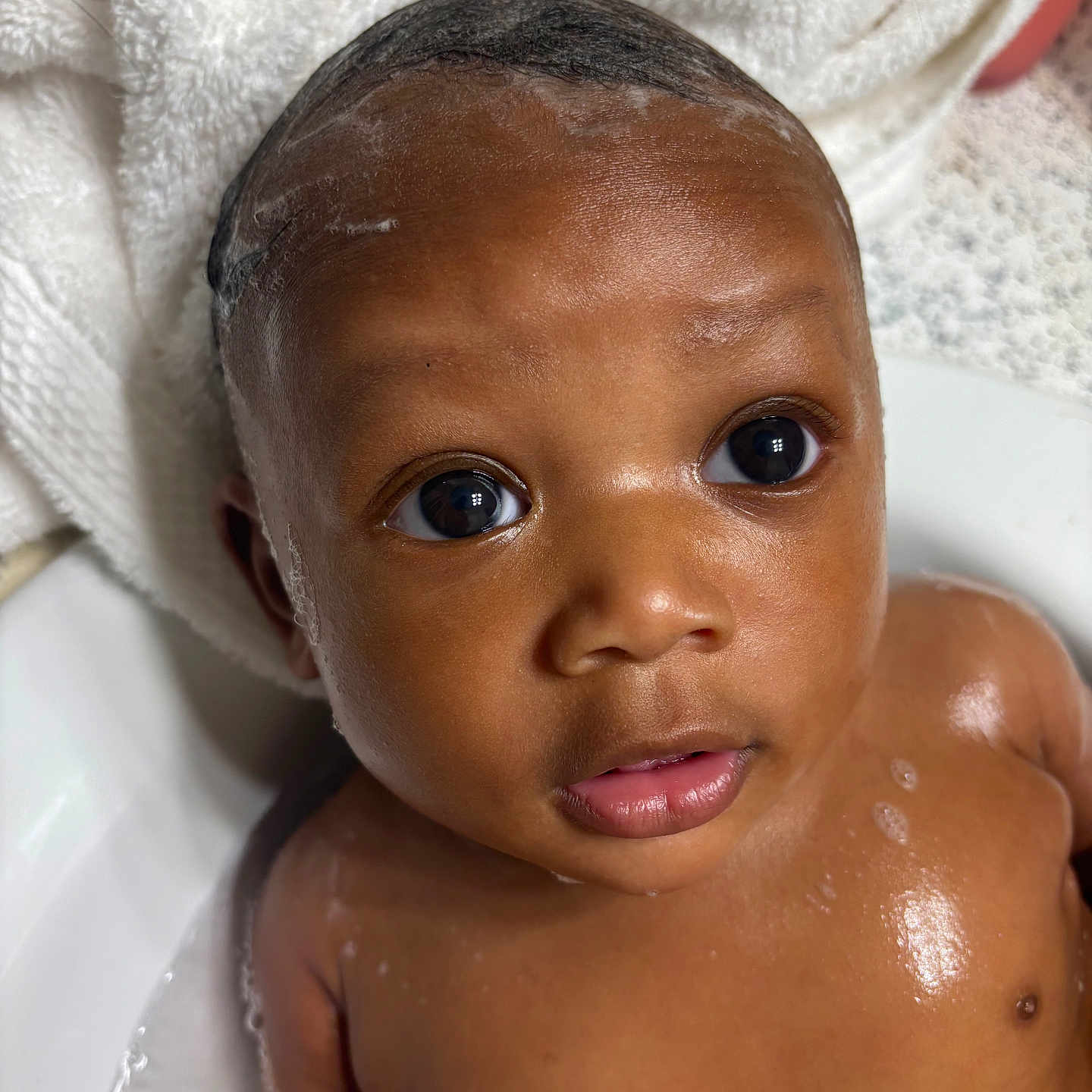 Akylo joined the competition — help win amazing prizes! baby, child, bath, water, soap, towel, skin, face, eyes, wet, cute, infant, head, portrait, expression, person, young, clean, hand, closeup
