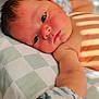 William joined the competition — help win amazing prizes! baby, newborn, infant, portrait, pillow, blanket, crib, sleepy, closeup, eye, cheek, arm, mittens, hair, skin, natural_light, shadows, sleep, nursery, bedding