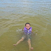 Abel joined the competition — help win amazing prizes! child, water, life_jacket, floating, lake, nature, outdoor, sky, clouds, summer, happy, young, recreation, swimming, feet, person, water_sport, vacation, fun, daylight