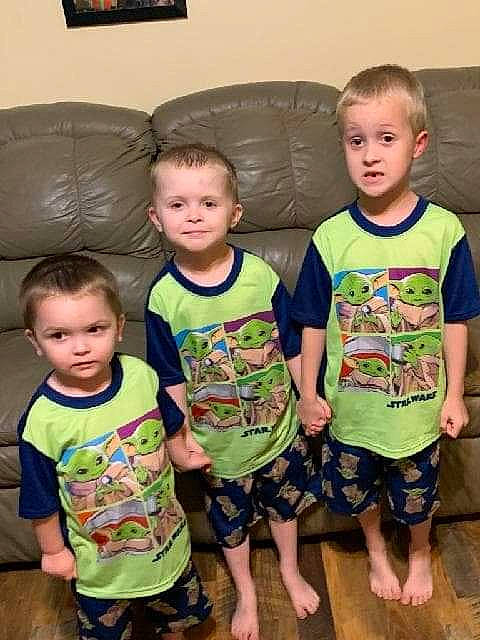 Desmond is registered to the contest to win money with this photo: baby_toddler_clothing, barefoot, child, event, facial_expression, fun, happy, human, human_body, iris, joy, leg, person, picture_frame, shorts, sitting, skin, sleeve, standing, t_shirt