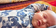 Nyko joined the competition — help win amazing prizes! baby, sleeping, onesie, blue, white, pattern, face, peaceful, infant, cozy, soft, blanket, indoor, closeup, child, rest, cute, portrait, relaxation, person