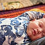 baby, sleeping, onesie, blue, white, pattern, face, peaceful, infant, cozy, soft, blanket, indoor, closeup, child, rest, cute, portrait, relaxation, person