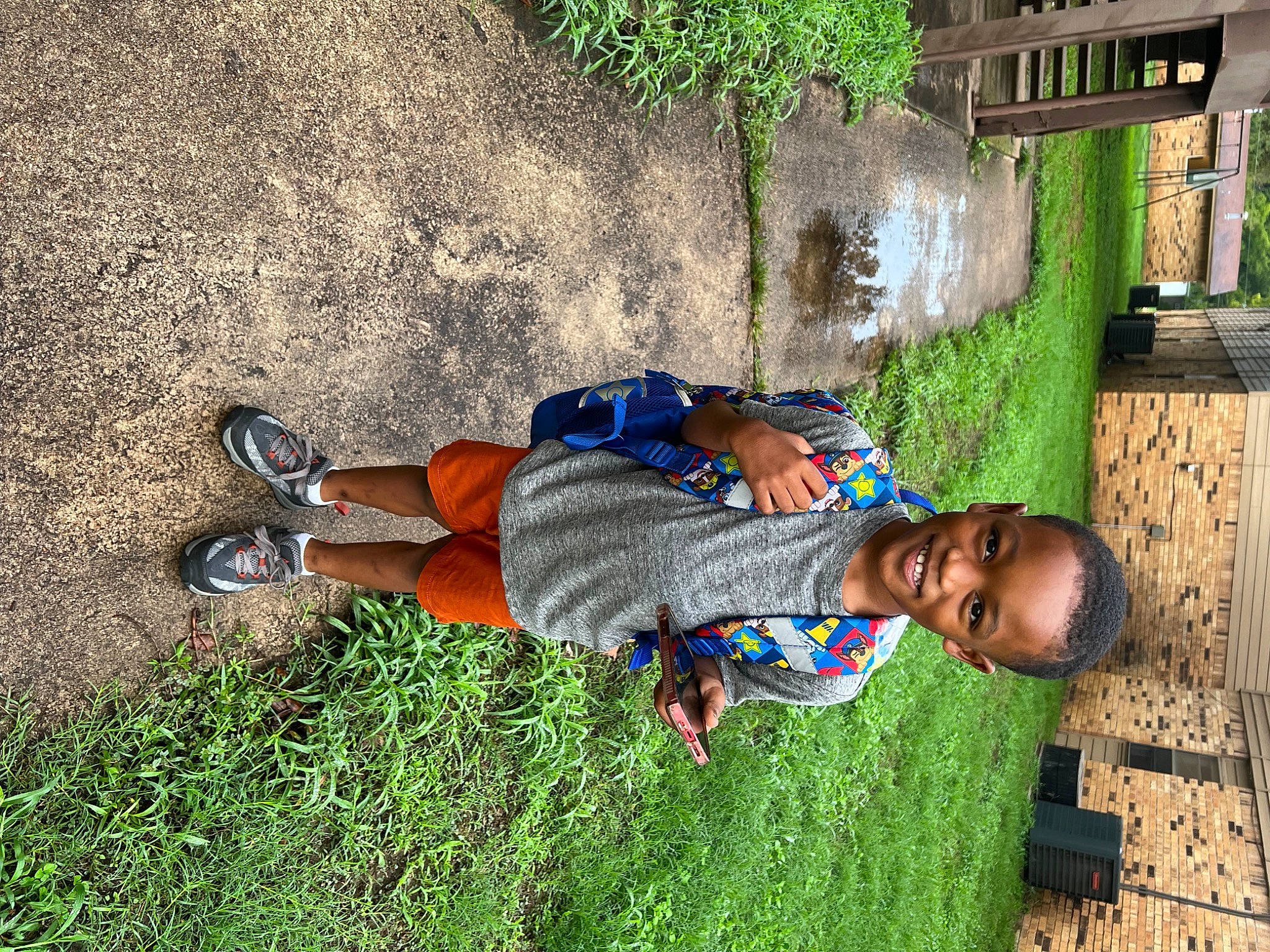 Jasiah is registered to the contest to win money with this photo: child, electric_blue, fun, grass, happy, joy, leisure, people_in_nature, person, plant, shadow, sitting, soil, sunglasses, t_shirt, toddler, tree, vacation, walking_shoe