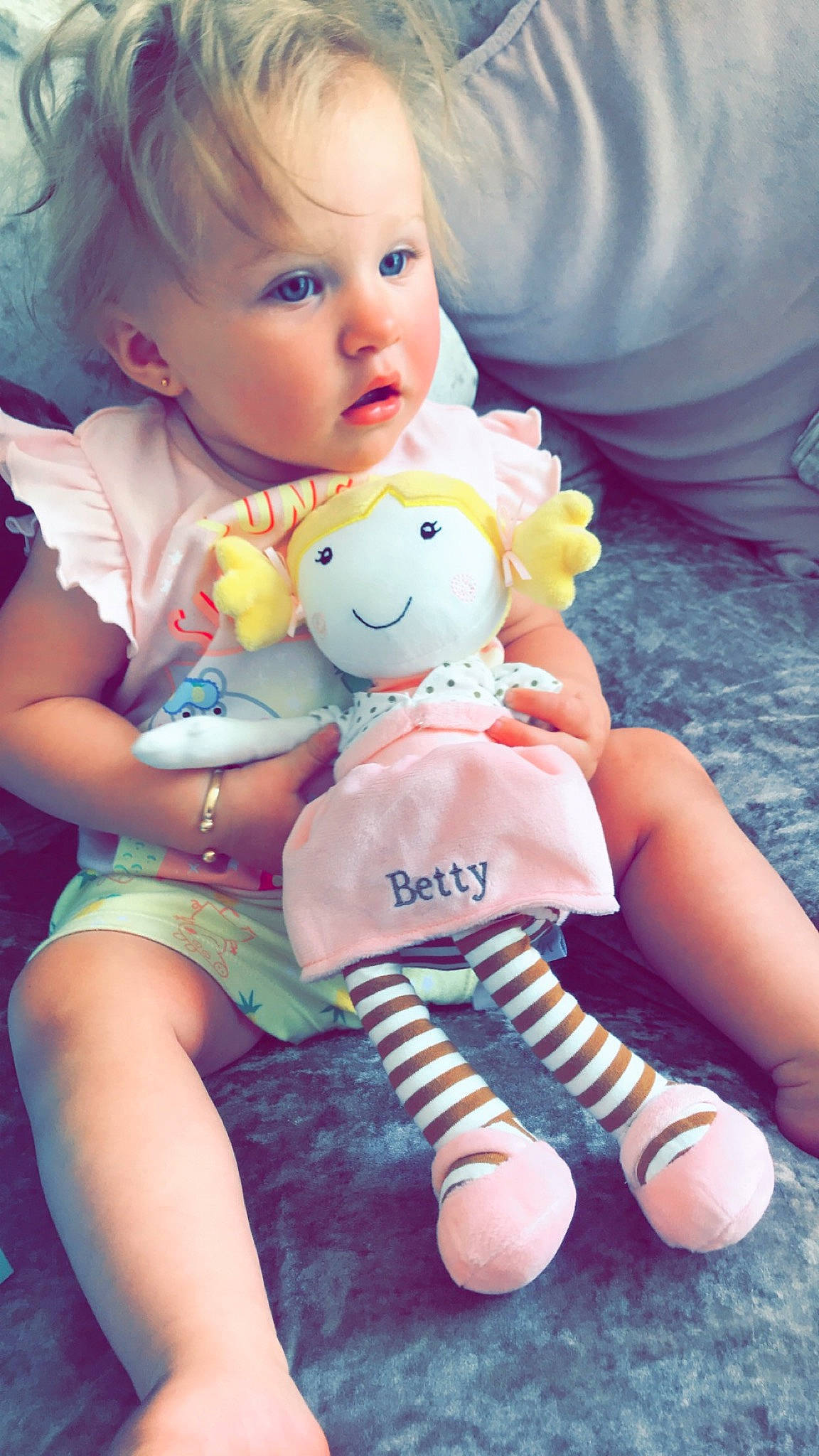 Betty joined the competition — help win amazing prizes! baby, baby_toys, blond, cheek, child, doll, person, pink, play, product, sitting, skin, smile, stuffed_toy, teddy_bear, toddler, toy