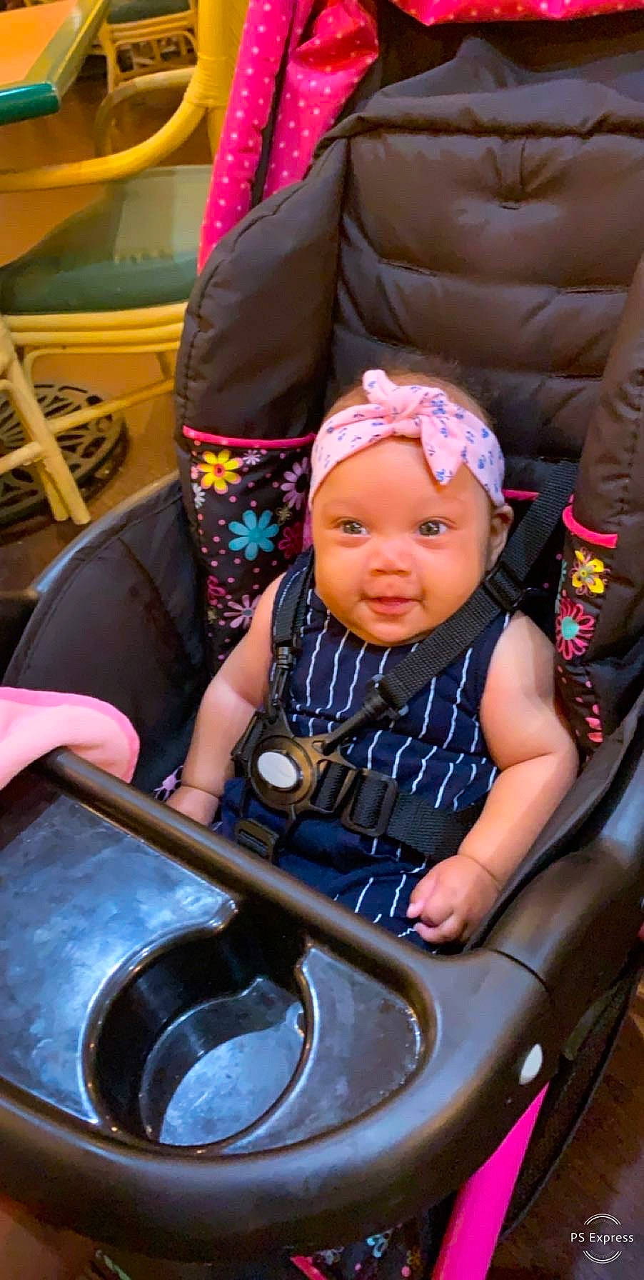 Stori is registered to the contest to win money with this photo: baby, baby_carriage, baby_products, child, headwear, musical_instrument, person, product, sitting, toddler