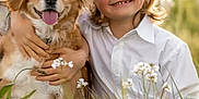 Nathael participe au concours pour gagner de l'argent avec cette photo : child, dog, smiling, hat, wildflowers, grass, outdoor, friendship, happy, nature, field, sunlight, portrait, person, animal, pet, cute, summer, casual, toddler