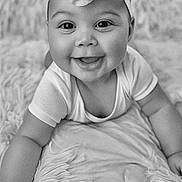 Honey joined the competition — help win amazing prizes! baby, infant, smiling, face, headband, flower, blanket, texture, black_and_white, portrait, cute, happy, child, skin, eyes, mouth, clothing, hand, lying_down, baby_girl