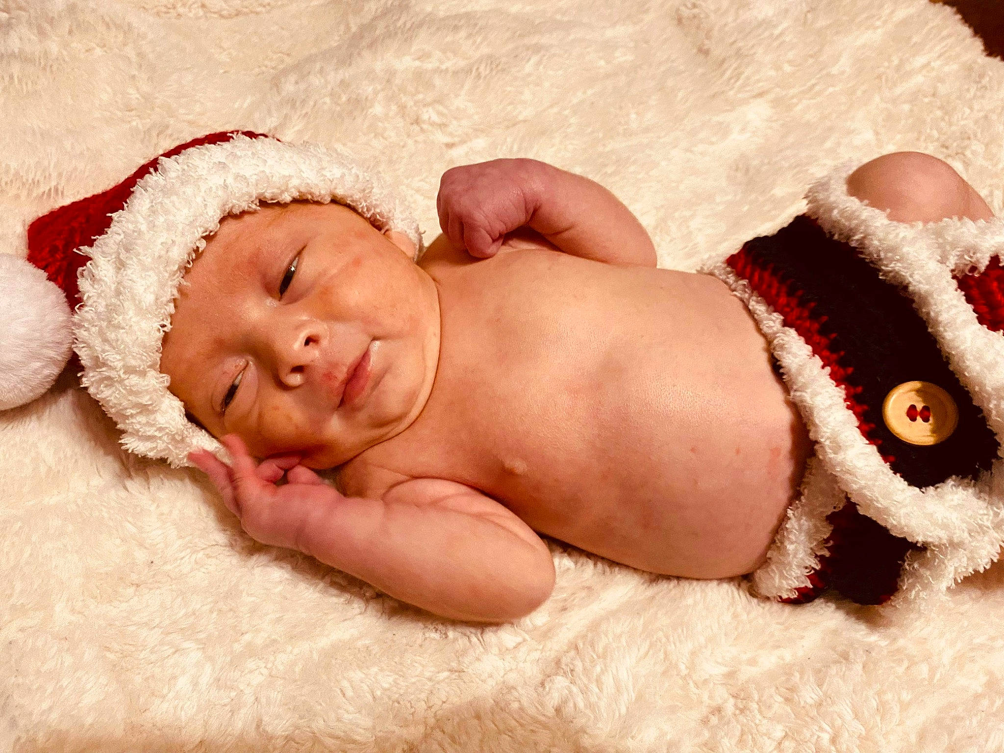 Leland is registered to the contest to win money with this photo: abdomen, art, baby, baby_products, baby_sleeping, baby_toddler_clothing, barechested, chest, child, comfort, fashion_accessory, fawn, flesh, foot, fur, headgear, headwear, linens, person, skin