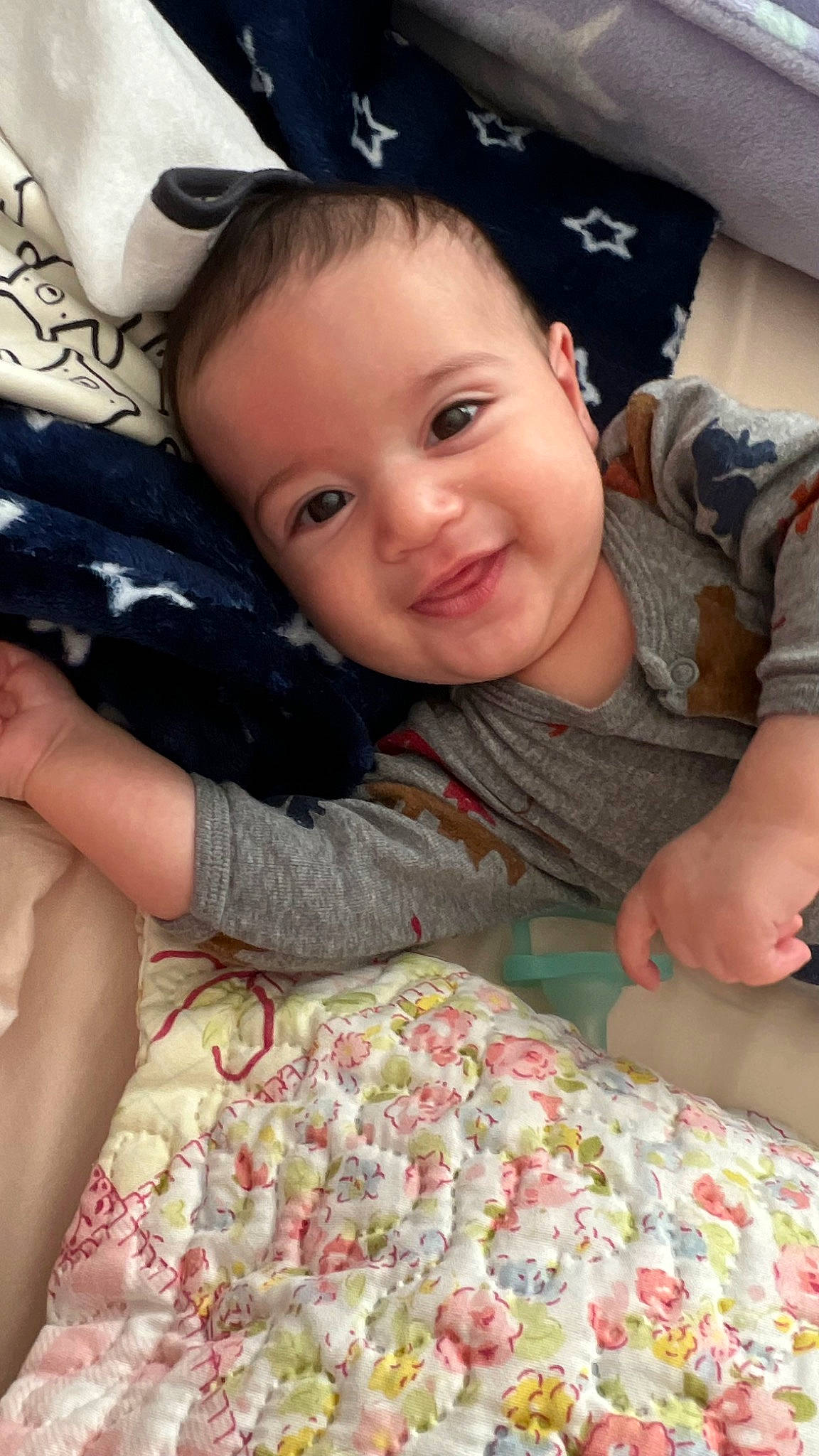 Asher is registered to the contest to win money with this photo: baby_toddler_clothing, cheek, child, comfort, eye, face, facial_expression, finger, fun, hairstyle, happy, iris, joy, muscle, organ, person, pink, product, skin, sleeve