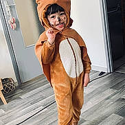 Jessim participe au concours pour gagner de l'argent avec cette photo : animal_costume, cape, child, childhood, costume, cute, door, ears, face_paint, floor, happy, home, hood, indoor, person, playful, portrait, smiling, socks, wooden_floor