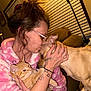 affection, animal, brown_couch, cat, comfort, cozy, cuddle, dog, furniture, glasses, hoodie, indoor, light_skin, love, orange_cat, person, pet, tan_dog, tattoo, window_blinds