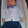 Sacha participe au concours pour gagner de l'argent avec cette photo : baby, infant, smiling, bow_tie, white_shirt, blue_pants, baby_shoes, lying_down, baby_carrier, cushion, cute, happy, clothing, footwear, newborn, portrait, child, baby_boy, casual_wear, indoor