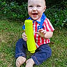 William joined the competition — help win amazing prizes! baby, child, grass, outdoor, smiling, toy, shirt, patriotic, greenery, happy, barefoot, nature, sitting, casual, cute, young, person, playful, daylight, infant