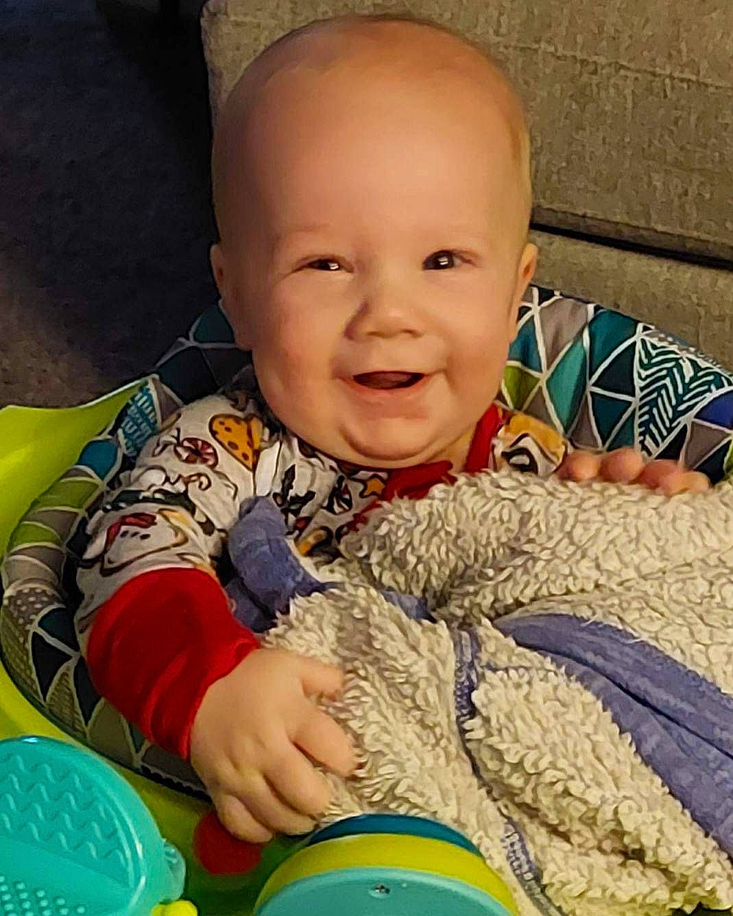 Flynn is registered to the contest to win money with this photo: baby, baby_laughing, baby_toddler_clothing, cheek, child, comfort, finger, fun, happy, iris, joy, nose, organ, people, person, product, skin, sleeve, smile, textile