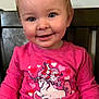 toddler, child, smile, pink_shirt, unicorn, hearts, long_sleeve, indoor, chair, cute, happy, portrait, person, clothing, baby, face, young_child, sitting, casual, bright_colors