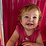 Mia Rose joined the competition — help win amazing prizes! child, toddler, smiling, happy, face, eyes, teeth, pink_clothing, curly_hair, indoors, portrait, cute, baby, seat, hand, skin, expression, joy, person, background