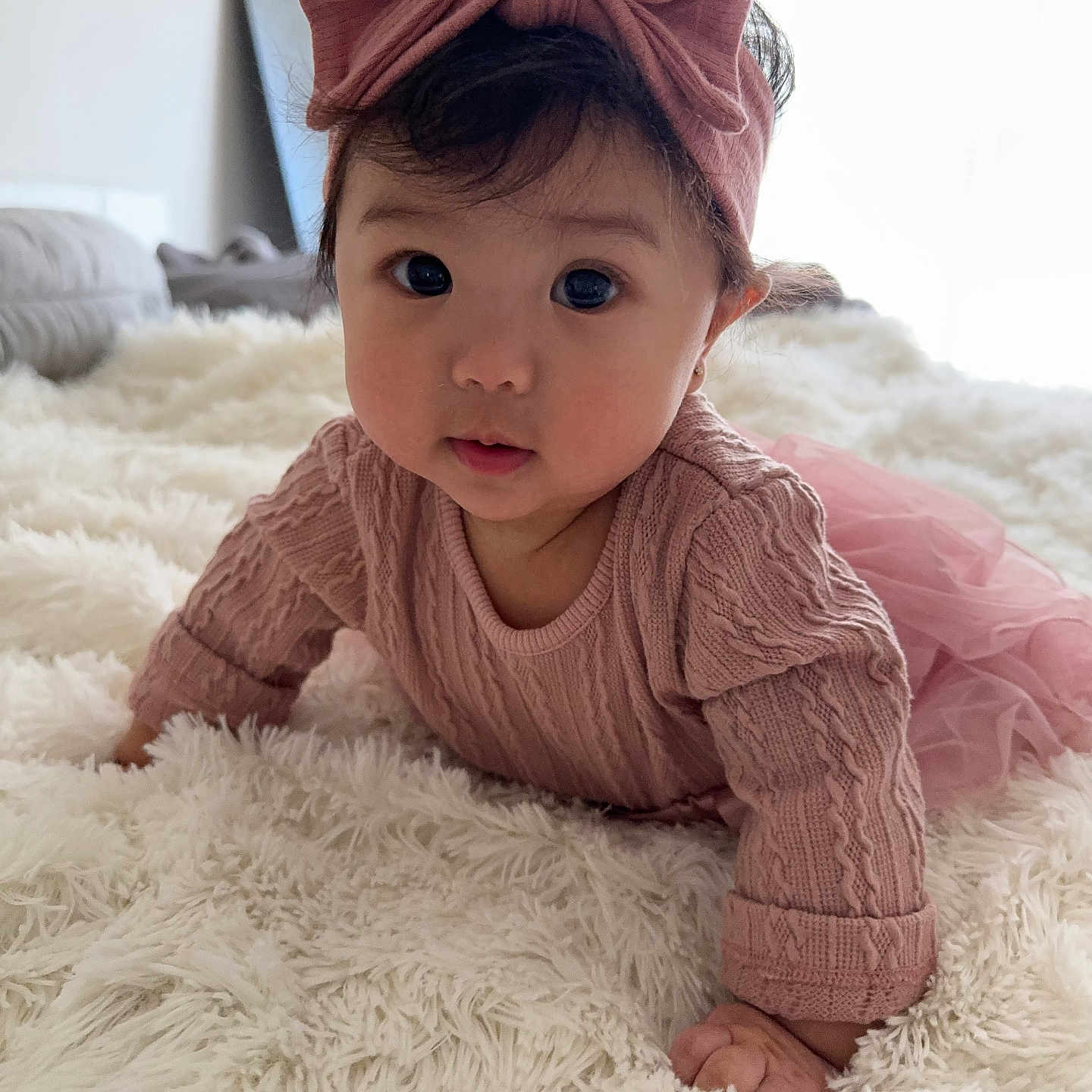 Camilla is registered to the contest to win money with this photo: baby, babycrawling, bonnet, clothing, crawling, cushion, dress, face, formalwear, hardwood, hat, head, homedecor, knitwear, newborn, person, photography, portrait, sweater, wood