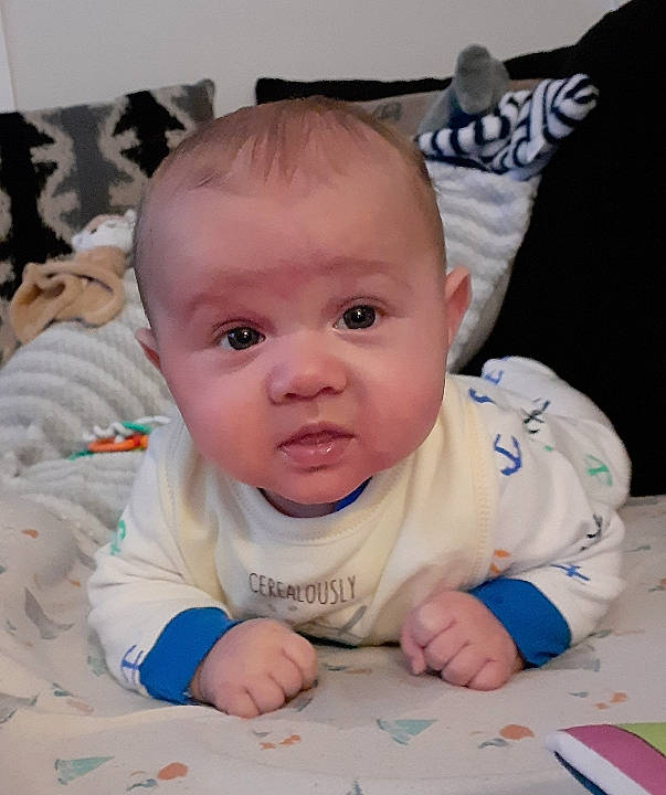 Zachariah joined the competition — help win amazing prizes! baby, baby_toddler_clothing, cheek, chin, eye, eyebrow, face, facial_expression, hair, hairstyle, hand, head, iris, lip, mouth, nose, person, skin, sleeve, smile