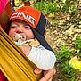 Elona a rejoint le concours — aidez-le/la à gagner de superbes lots ! baby, infant, pacifier, cap, hat, hand, sling, outdoor, forest, nature, greenery, person, child, sleeping, resting, clothing, closeup, parent, support, relaxation