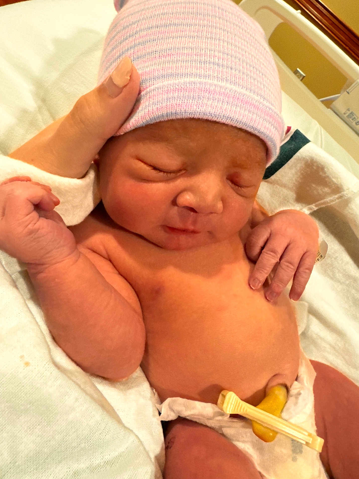 Josiah joined the competition — help win amazing prizes! newborn, baby, infant, sleeping, hat, hospital, umbilical_cord, diaper, hand, skin, blanket, bed, person, cute, peaceful, resting, hospital_room, medical, child, human