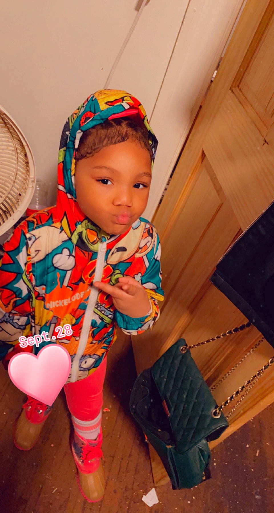 Loyalty is registered to the contest to win money with this photo: baby, baby_toddler_clothing, cap, child, costume, fashion_accessory, flooring, fun, happy, helmet, human_leg, magenta, mechanical_fan, orange, pattern, person, personal_protective_equipment, sitting, skin, thigh