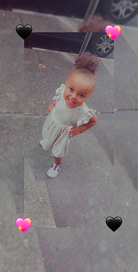 Miracle is registered to the contest to win money with this photo: asphalt, baby, balloon, car, child, concrete, floor, flooring, fun, happy, joy, line, person, pink, recreation, road_surface, sidewalk, smile, tire, toddler